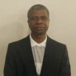 Formal portrait of person in suit