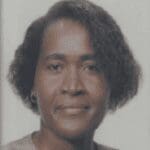 Headshot of woman with short curly hair